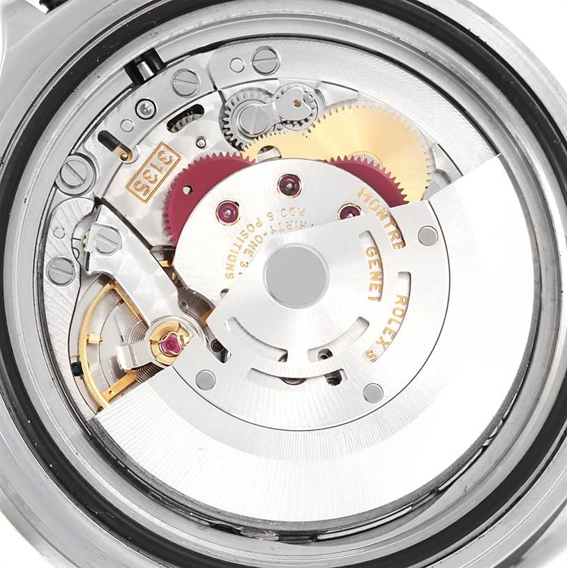 This image shows a close-up of the inner mechanical parts of a Rolex Submariner 16610 Men's Stainless Steel Black Dial 16610 Men's Stainless Steel Black Dial watch, focusing on the movement and gears.