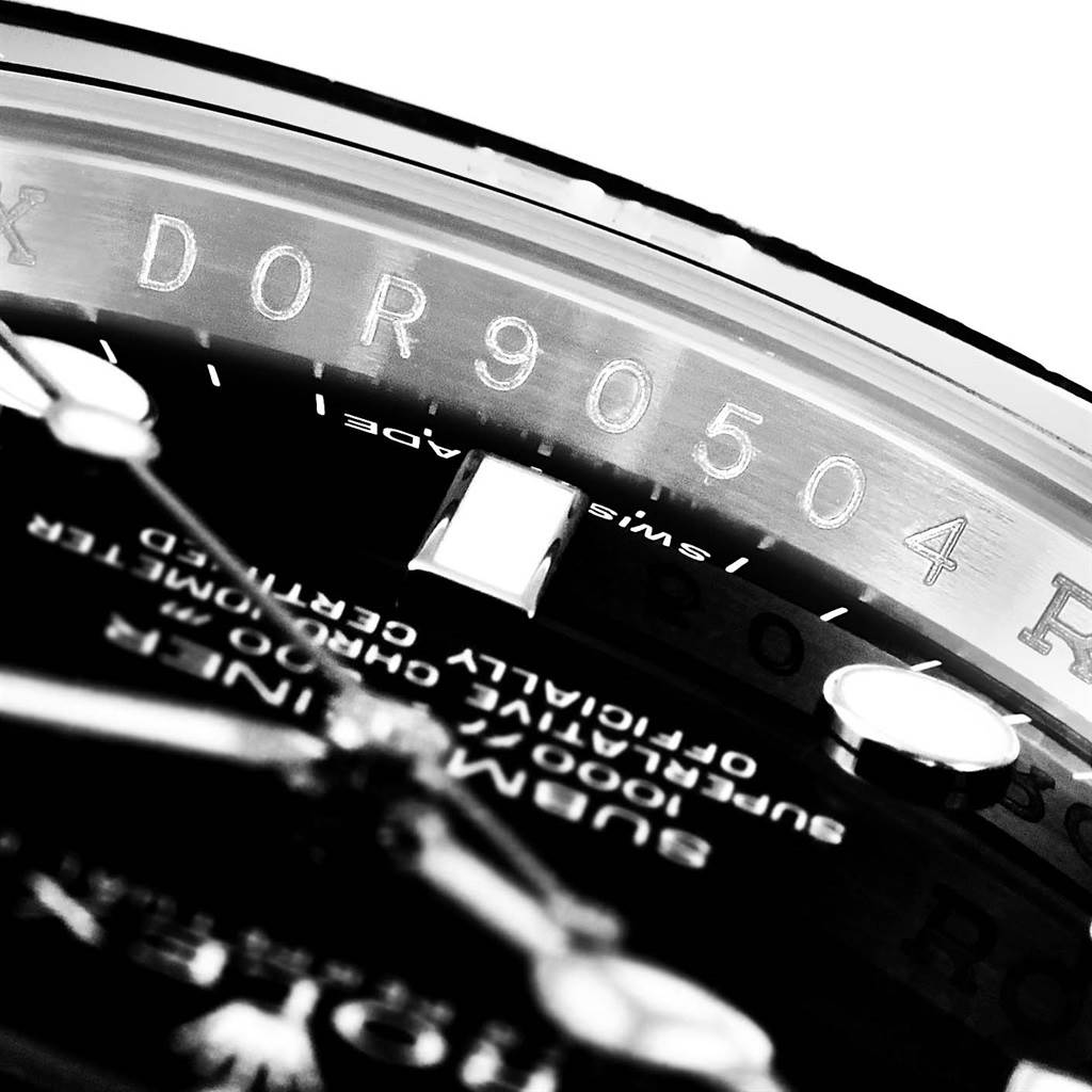 The image shows a close-up of the Rolex Submariner 116610 Men's Stainless Steel Black Dial 116610 Men's Stainless Steel Black Dial model, focusing on its dial, bezel, and part of the serial number.