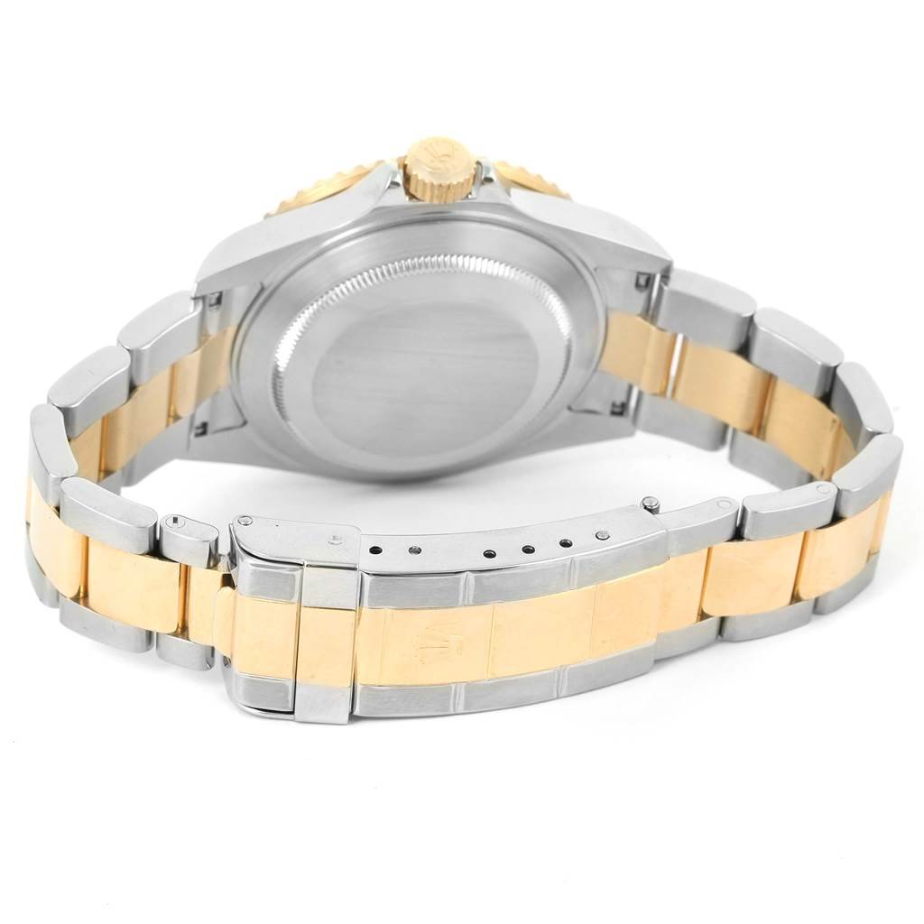 The image shows the back and bracelet clasp of a Rolex Submariner 16613 Men's Steel and Gold (two tone) Champagne Dial 16613 Men's Steel and Gold (two tone) Champagne Dial watch, featuring a gold and stainless steel combination.