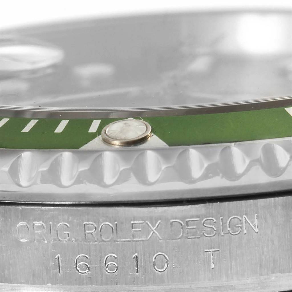Close-up view of the side profile of a Rolex Submariner 16610LV Men's Stainless Steel Black Dial 16610LV Men's Stainless Steel Black Dial watch, showing the bezel, crystal, and engraved case number 16610.