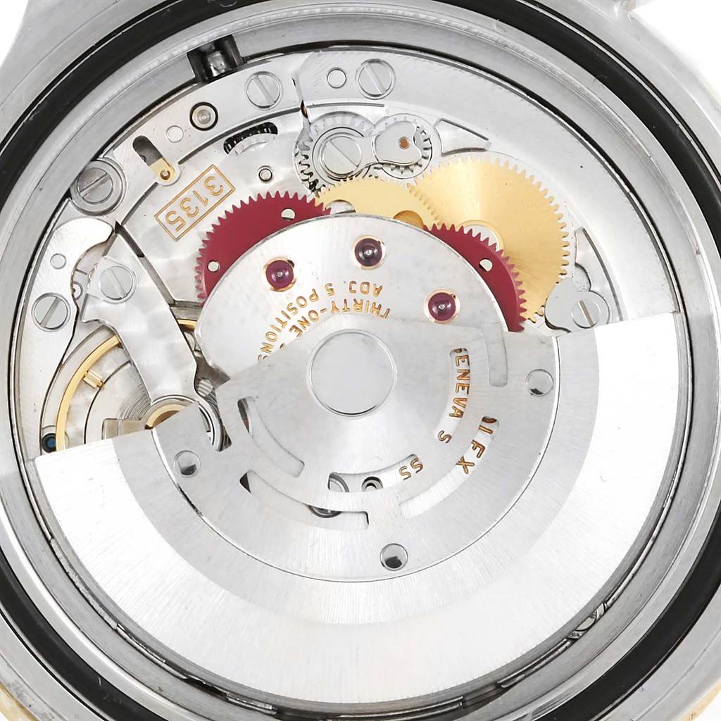 The image shows the internal mechanism and movement parts of a Rolex Submariner 16613 Men's Steel and Gold (two tone) Blue Dial 16613 Men's Steel and Gold (two tone) Blue Dial watch at a close-up angle.