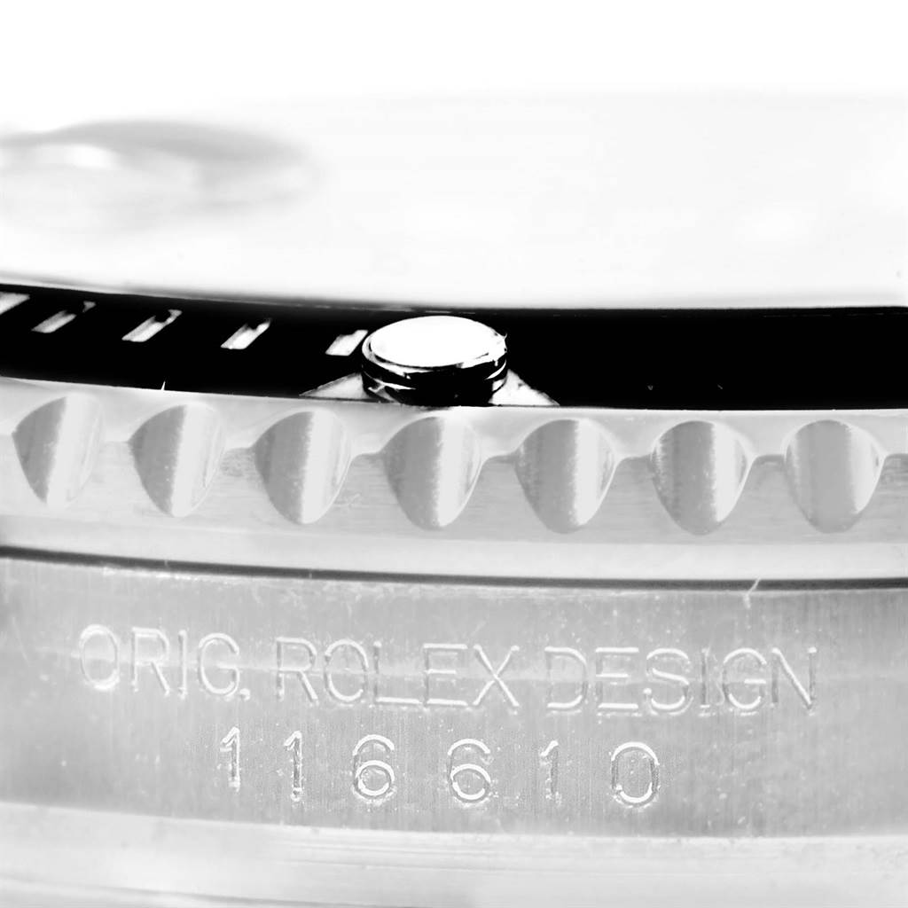 This close-up image of a Rolex Submariner 116610 Men's Stainless Steel Black Dial 116610 Men's Stainless Steel Black Dial watch shows the edge of the bezel and engraved model number "116610" on the case.