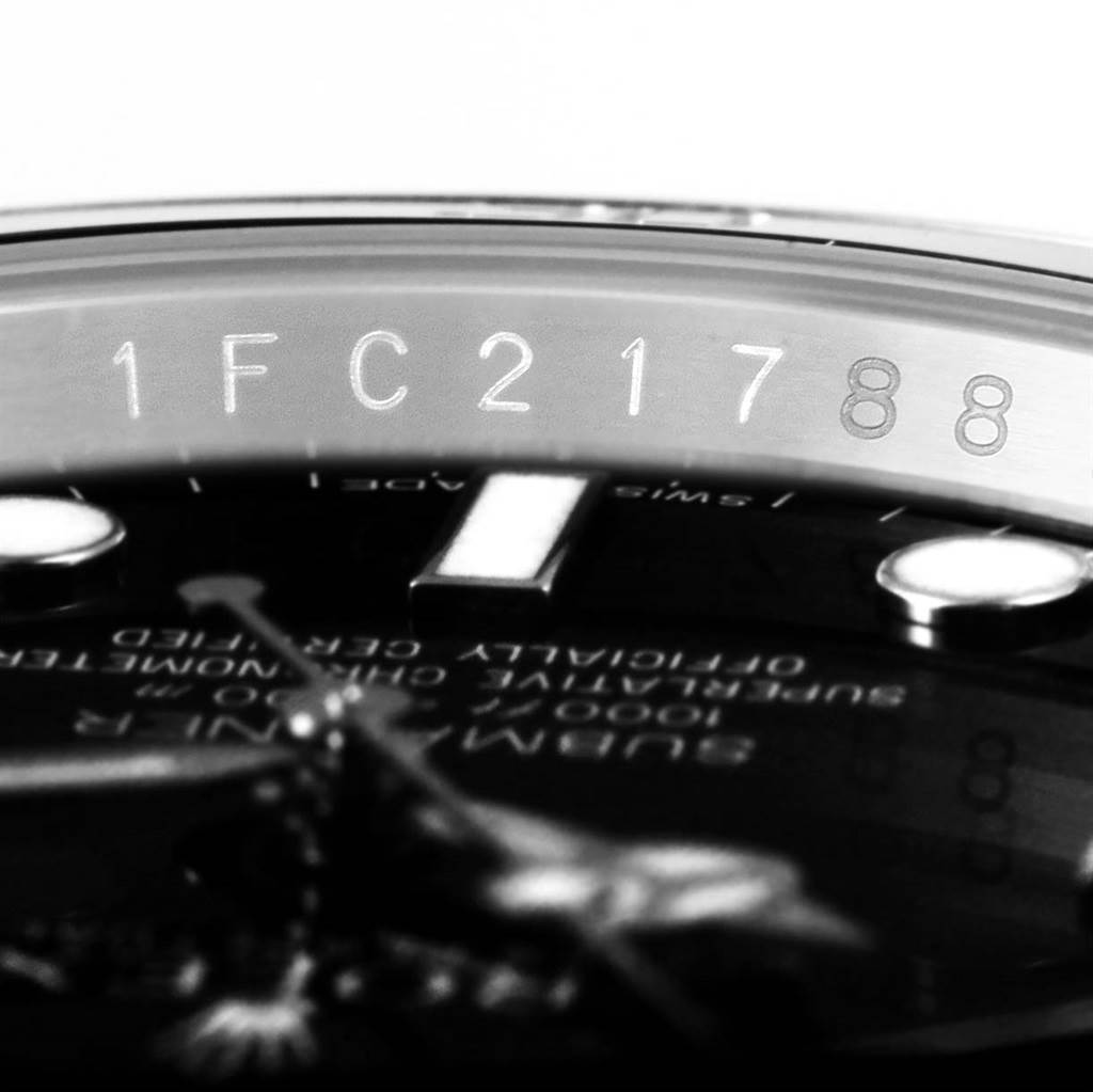 This image shows the serial number part of a Rolex Submariner 116610 Men's Stainless Steel Black Dial 116610 Men's Stainless Steel Black Dial watch from an angled close-up view.