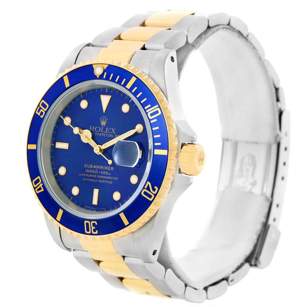 The Rolex Submariner 16613 Men's Steel and Gold (two tone) Blue Dial 16613 Men's Steel and Gold (two tone) Blue Dial is shown at a 3/4 angle, highlighting the dial, bezel, crown, and two-tone metal bracelet.