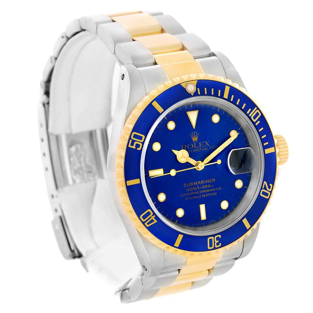 The image shows a Rolex Submariner 16613 Men's Steel and Gold (two tone) Blue Dial 16613 Men's Steel and Gold (two tone) Blue Dial watch at a slight angle, highlighting the blue dial, gold bezel, and two-tone bracelet.