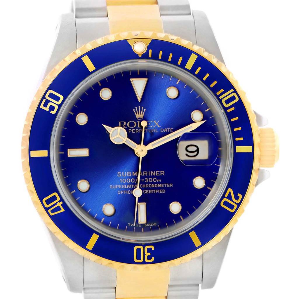 This Rolex Submariner 16613 Men's Steel and Gold (two tone) Blue Dial 16613 Men's Steel and Gold (two tone) Blue Dial watch is displayed from the front, showing its blue dial, gold and blue bezel, and part of its two-tone bracelet.