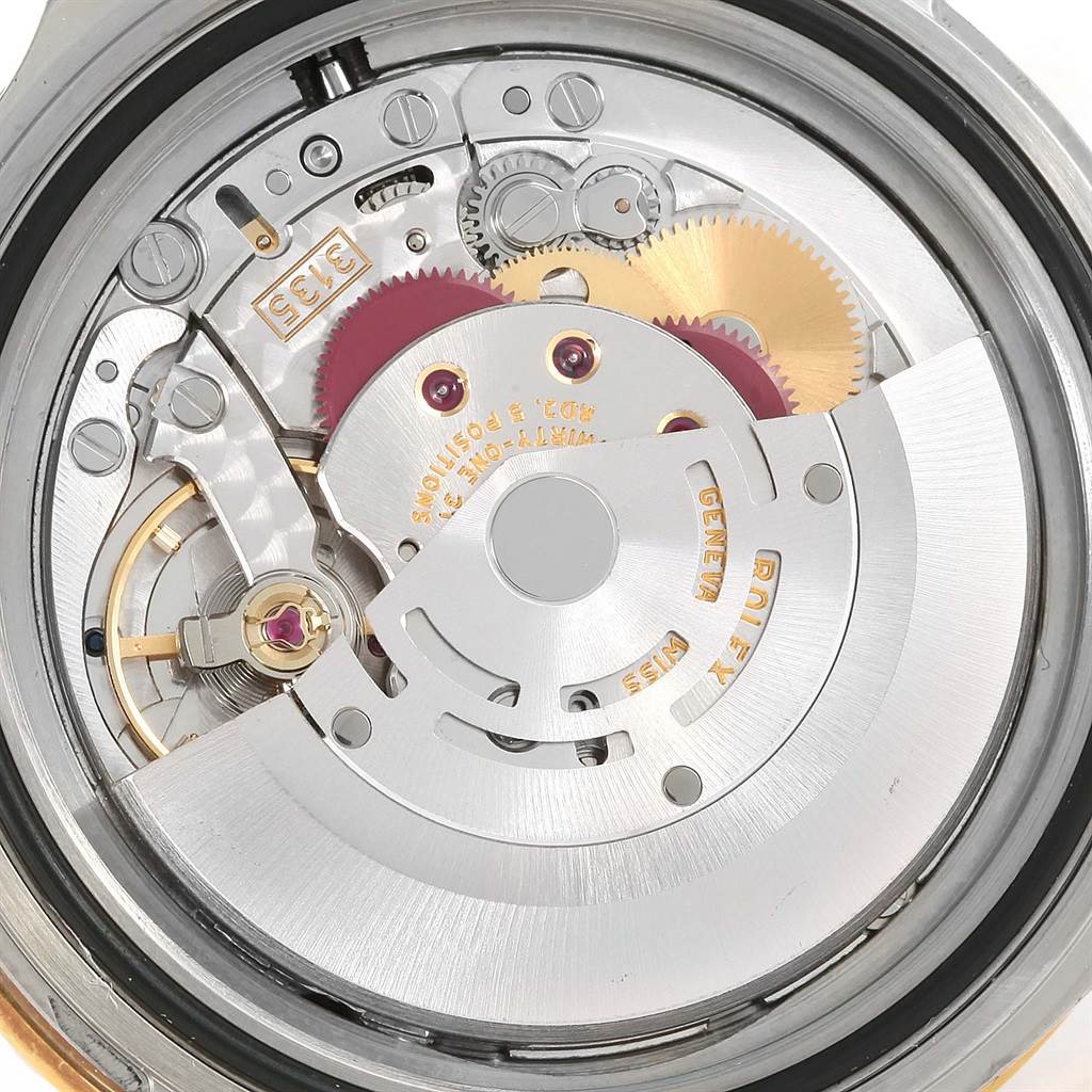 The image shows the inner movement mechanism of the Rolex Submariner 16613 Men's Steel and Gold (two tone) Blue Dial 16613 Men's Steel and Gold (two tone) Blue Dial watch from a rear angle.