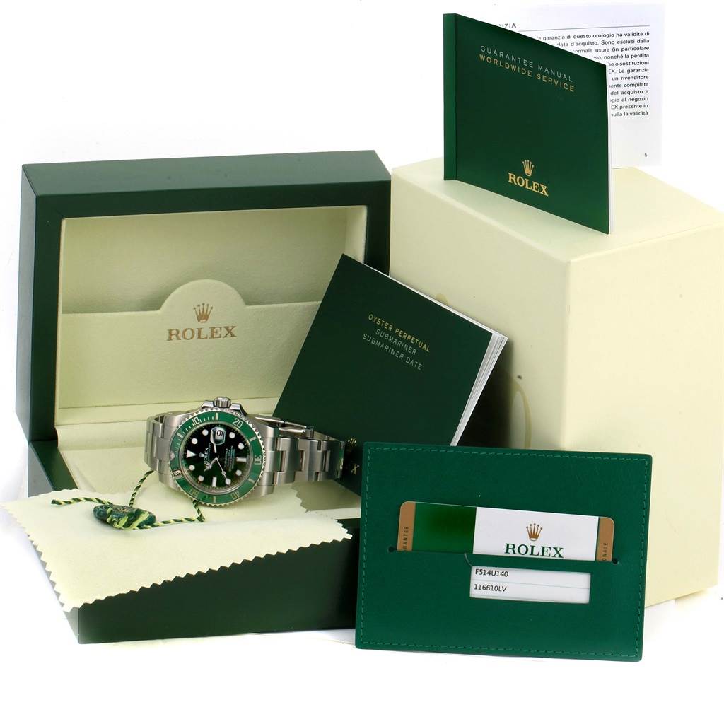 This image shows a complete set of a Rolex Submariner 116610LV Men's Stainless Steel Green Dial 116610LV Men's Stainless Steel Green Dial watch including the watch, box, guarantee manual, and warranty card.