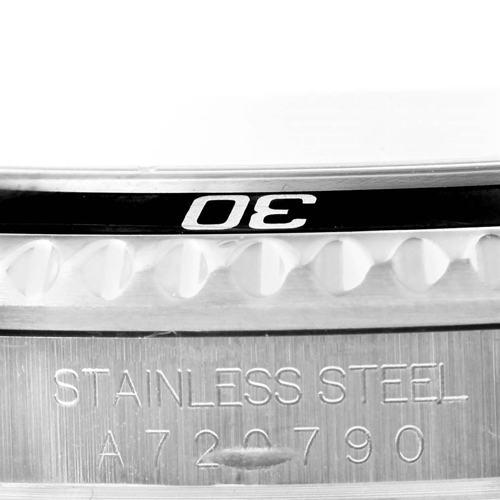 This image shows a close-up of the bezel and side engraving on a Rolex Submariner 16610 Men's Stainless Steel Black Dial 16610 Men's Stainless Steel Black Dial watch.