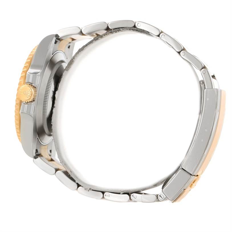 This side-angle image shows the bracelet, clasp, and crown of a Rolex Submariner 116613LN Men's Steel and Gold (two tone) Black Dial 116613LN Men's Steel and Gold (two tone) Black Dial watch.