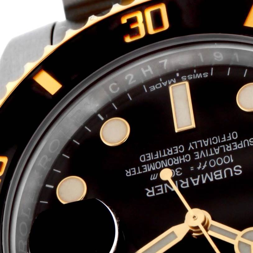 This close-up angle shows the face and bezel of the Rolex Submariner 116613LN Men's Steel and Gold (two tone) Black Dial 116613LN Men's Steel and Gold (two tone) Black Dial watch, highlighting the "30" marker and part of the dial.