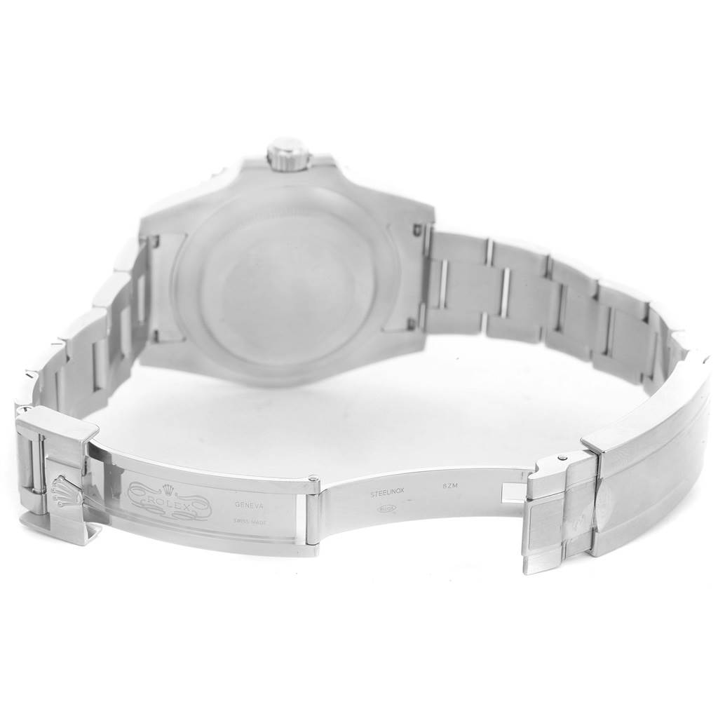 This image shows the open clasp and back case of a Rolex Submariner 116610LV Men's Stainless Steel Green Dial 116610LV Men's Stainless Steel Green Dial watch.