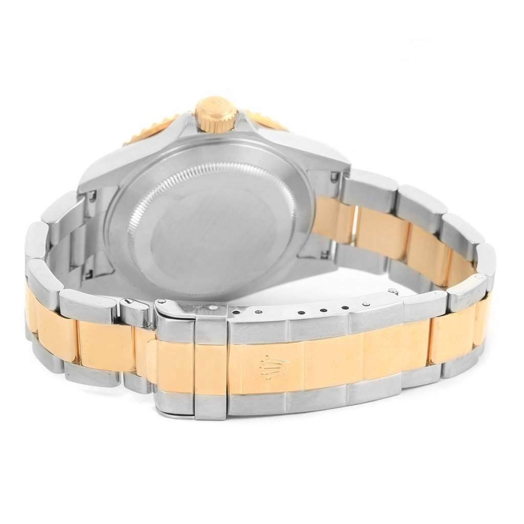 The image shows the back and bracelet of a Rolex Submariner 16613 Men's Steel and Gold (two tone) Champagne Dial 16613 Men's Steel and Gold (two tone) Champagne Dial watch, highlighting the clasp and case back.