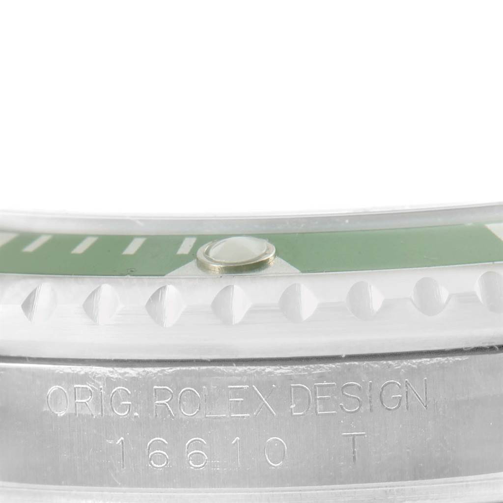 The image shows a close-up of the bezel and engraved side of the case of the Rolex Submariner 16610LV Men's Stainless Steel Black Dial 16610LV Men's Stainless Steel Black Dial model.