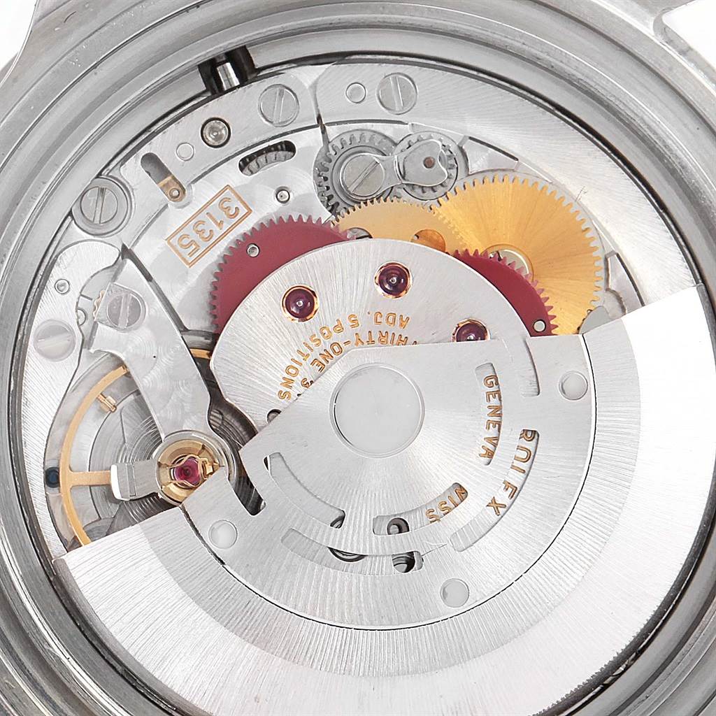 This image shows a close-up view of the movement mechanism components of a Rolex Submariner 16610LV Men's Stainless Steel Black Dial 16610LV Men's Stainless Steel Black Dial watch.