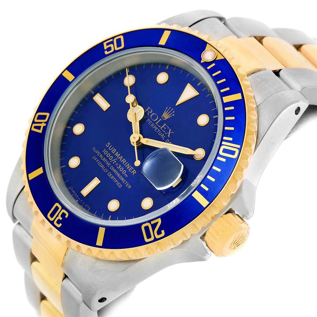The image displays a close-up angle of a Rolex Submariner 16613 Men's Steel and Gold (two tone) Blue Dial 16613 Men's Steel and Gold (two tone) Blue Dial watch showcasing its blue dial, bezel, and crown.