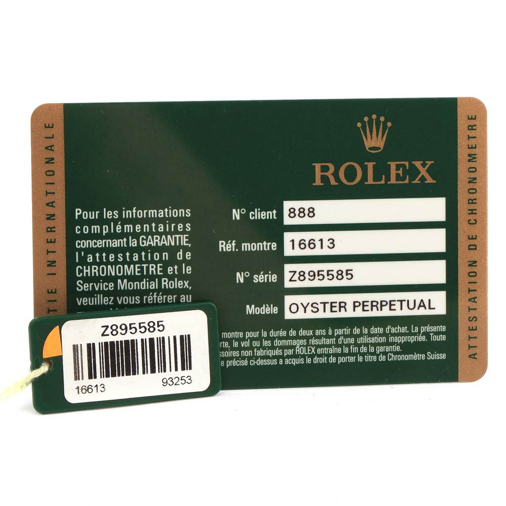 The image shows the warranty card and tag for the Rolex Submariner 16613 Men's Steel and Gold (two tone) Blue Dial 16613 Men's Steel and Gold (two tone) Blue Dial Oyster Perpetual model, with reference and serial numbers visible.