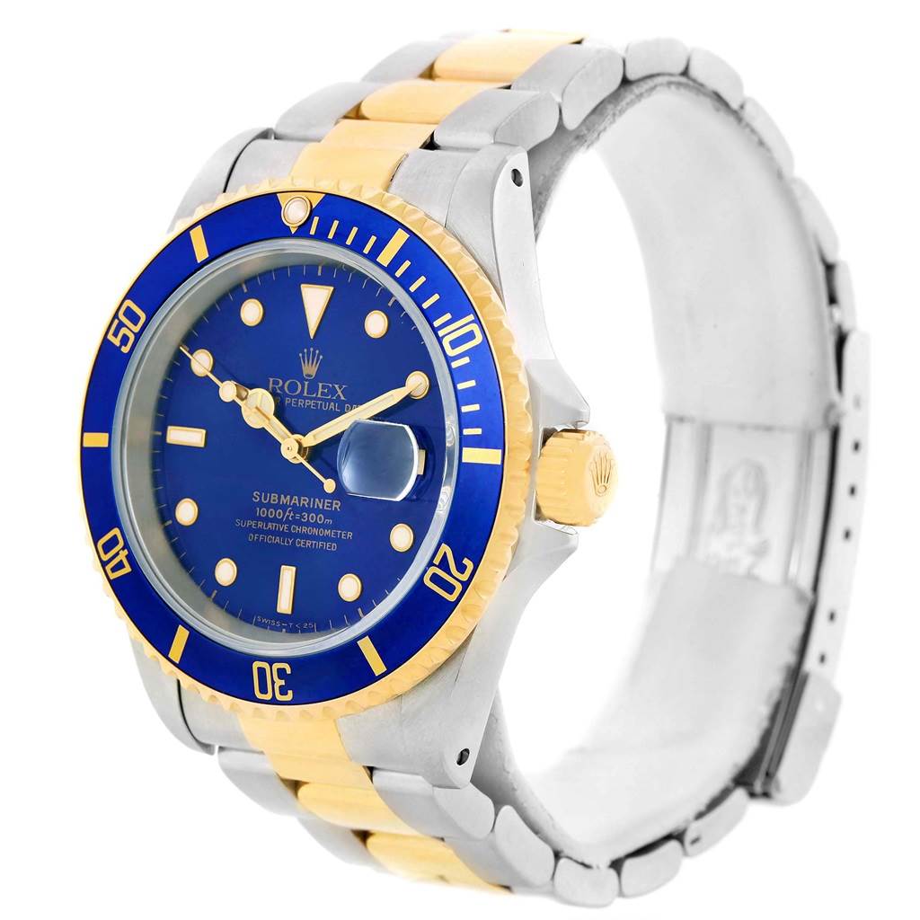 The image shows a Rolex Submariner 16613 Men's Steel and Gold (two tone) Blue Dial 16613 Men's Steel and Gold (two tone) Blue Dial watch at an oblique angle highlighting the blue dial, bezel, and bi-metal bracelet.