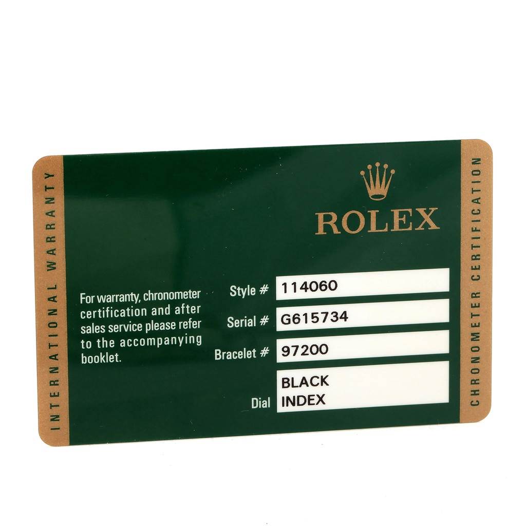 This image shows the international warranty card for a Rolex Submariner 114060 Men's Stainless Steel Black Dial 114060 Men's Stainless Steel Black Dial model with style #114060 and serial #G615734.