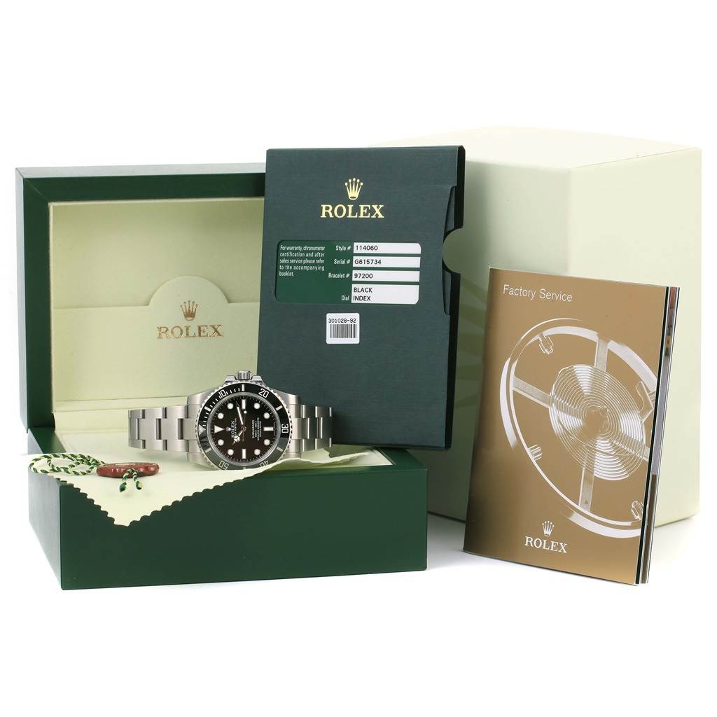 The Rolex Submariner 114060 Men's Stainless Steel Black Dial 114060 Men's Stainless Steel Black Dial watch is displayed front-on, with its box, booklet, tags, and authentication card visible.