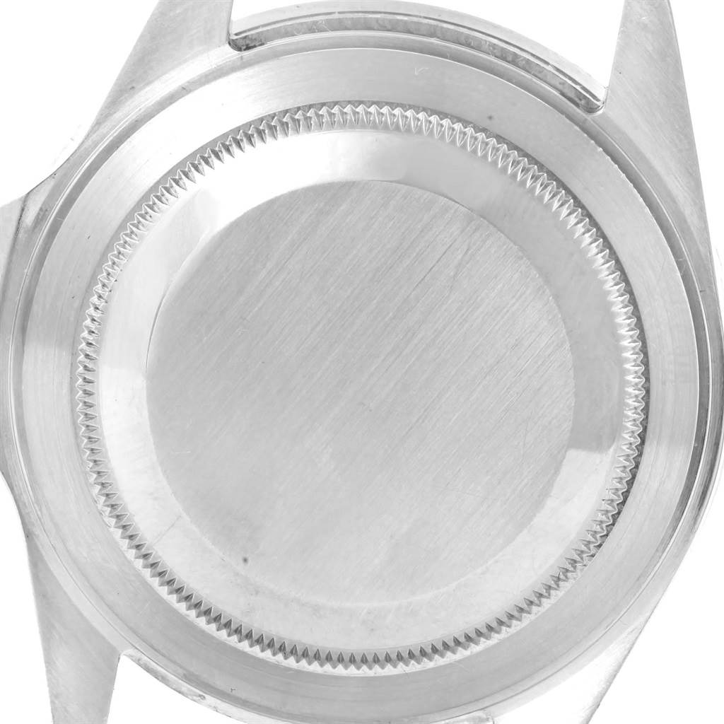 The image shows the back case of a Rolex Submariner 16610 Men's Stainless Steel Black Dial 16610 Men's Stainless Steel Black Dial watch, taken from a top-down angle.