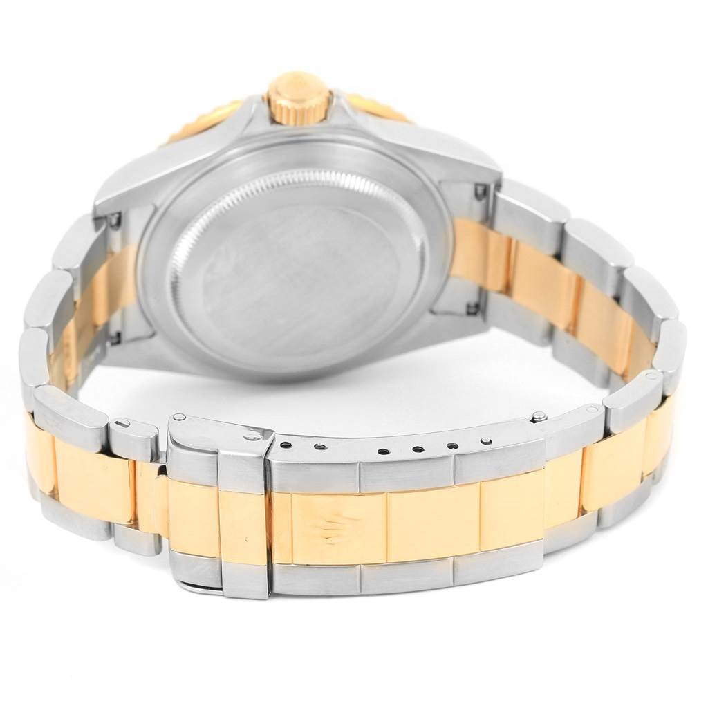 The image shows the back and bracelet of a Rolex Submariner 16613 Men's Steel and Gold (two tone) Grey Dial 16613 Men's Steel and Gold (two tone) Grey Dial, highlighting the clasp and case back.