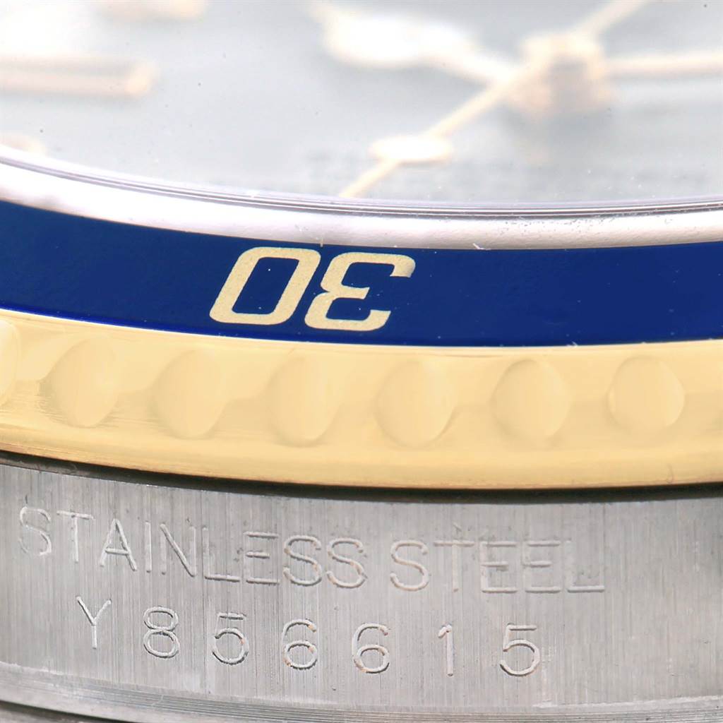 This close-up shows the bezel and serial number on the case of the Rolex Submariner 16613 Men's Steel and Gold (two tone) Grey Dial 16613 Men's Steel and Gold (two tone) Grey Dial watch.