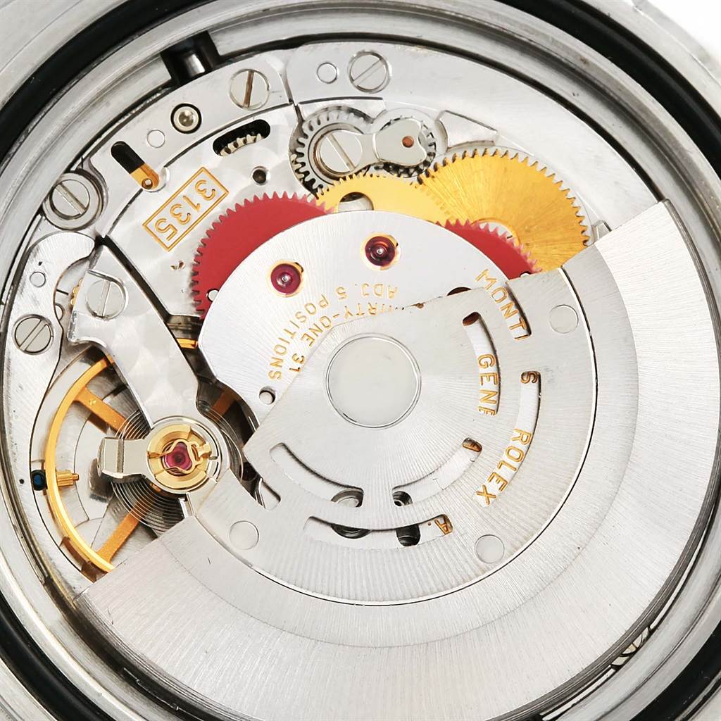 This is an image showing the intricate internal mechanism of a Rolex Submariner 16610 Men's Stainless Steel Black Dial 16610 Men's Stainless Steel Black Dial watch, viewed from the back.