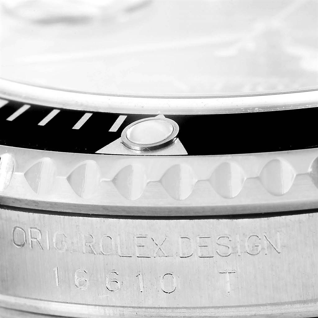 Close-up of the Rolex Submariner 16610 Men's Stainless Steel Black Dial 16610 Men's Stainless Steel Black Dial showing the bezel, case engraving, and model number 16610T.