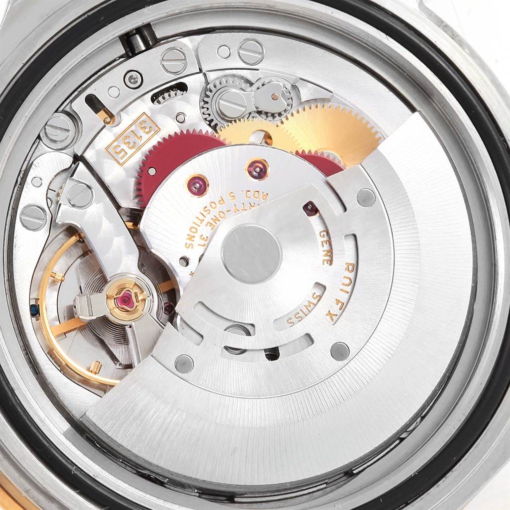 This image shows an inside view of the movement mechanism of a Rolex Submariner 16613 Men's Steel and Gold (two tone) Blue Dial 16613 Men's Steel and Gold (two tone) Blue Dial watch from the back.