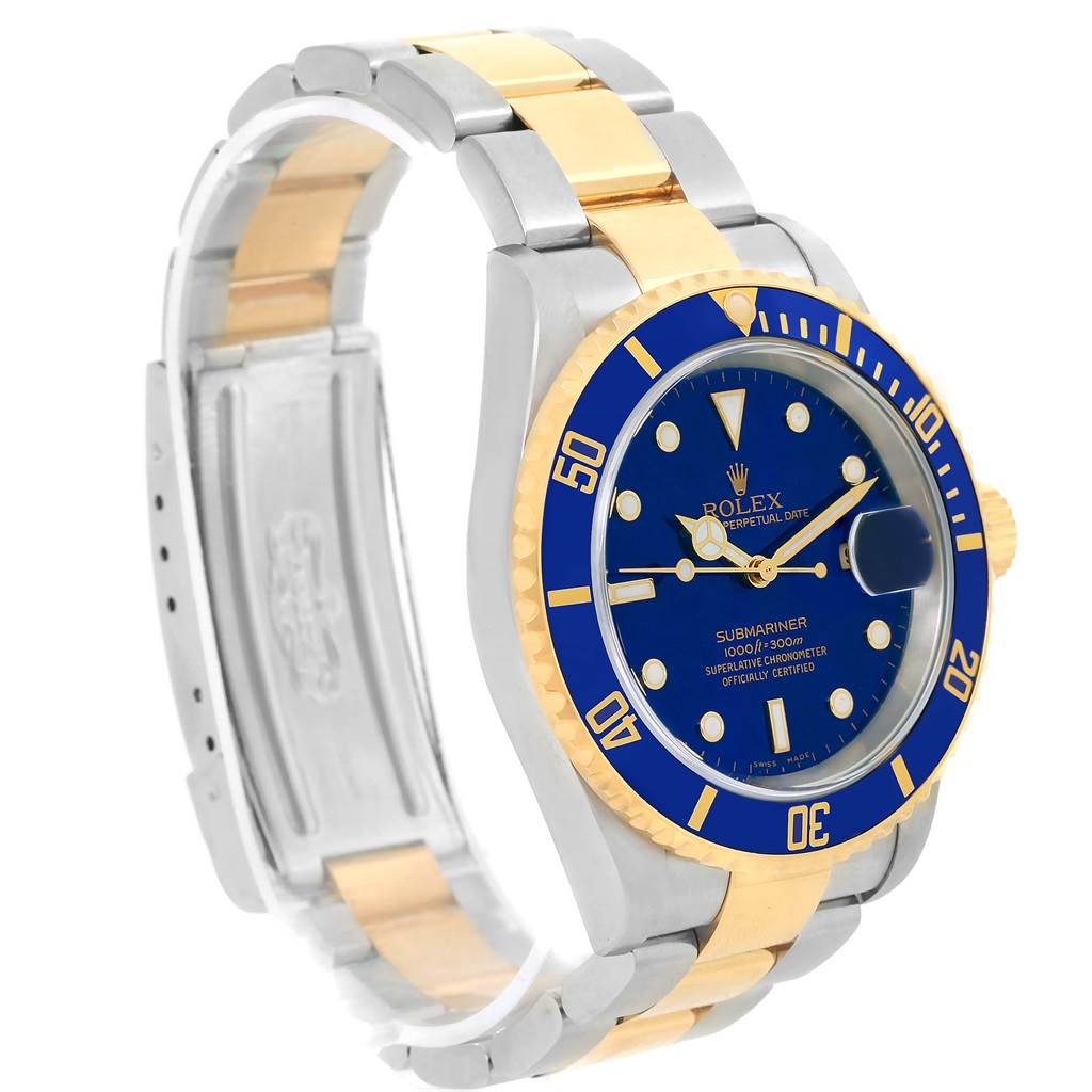 The image shows a front-left angle of a Rolex Submariner 16613 Men's Steel and Gold (two tone) Blue Dial 16613 Men's Steel and Gold (two tone) Blue Dial, highlighting its blue dial, gold and silver bezel, and bi-metal bracelet.