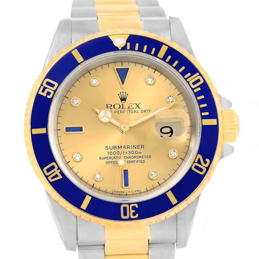 This image shows a front view of a Rolex Submariner 16613 Men's Steel and Gold (two tone) Champagne Dial 16613 Men's Steel and Gold (two tone) Champagne Dial watch featuring a gold dial, blue bezel, and two-tone bracelet.