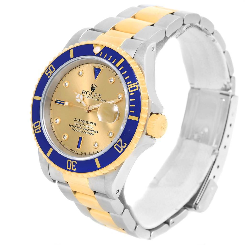 This image shows a Rolex Submariner 16613 Men's Steel and Gold (two tone) Champagne Dial 16613 Men's Steel and Gold (two tone) Champagne Dial watch from an angle that reveals the face, bezel, and bracelet.