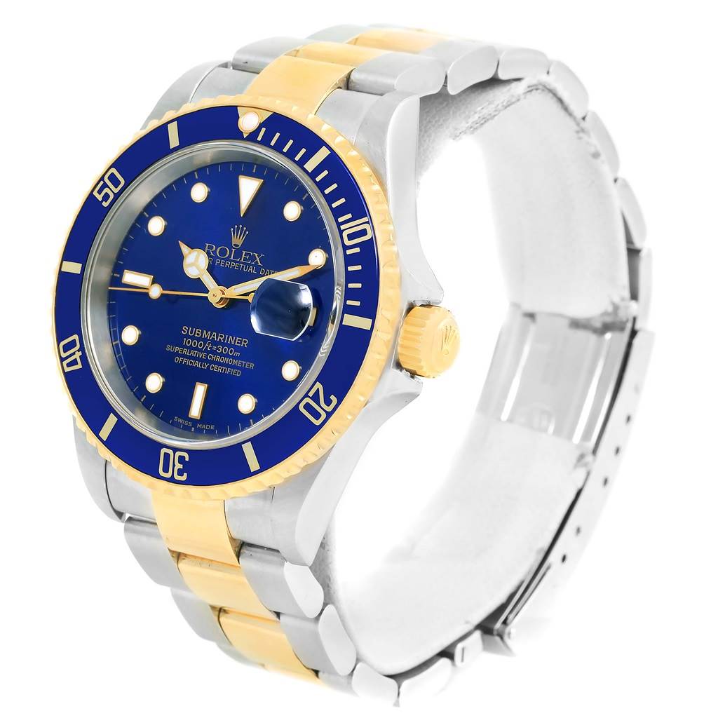 This image shows the Rolex Submariner 16613 Men's Steel and Gold (two tone) Blue Dial 16613 Men's Steel and Gold (two tone) Blue Dial watch at a slight angle, highlighting the blue dial, bezel, and the two-tone bracelet.