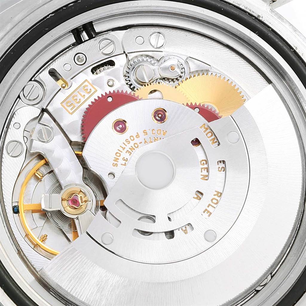 Close-up of Rolex Submariner 16613 Men's Steel and Gold (two tone) Blue Dial 16613 Men's Steel and Gold (two tone) Blue Dial's inner watch mechanism, showcasing gears and components from a top-down angle.