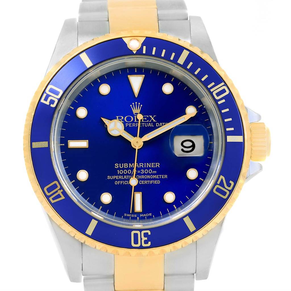 The image shows a frontal view of a Rolex Submariner 16613 Men's Steel and Gold (two tone) Blue Dial 16613 Men's Steel and Gold (two tone) Blue Dial watch, highlighting the dial, bezel, and partial bracelet.