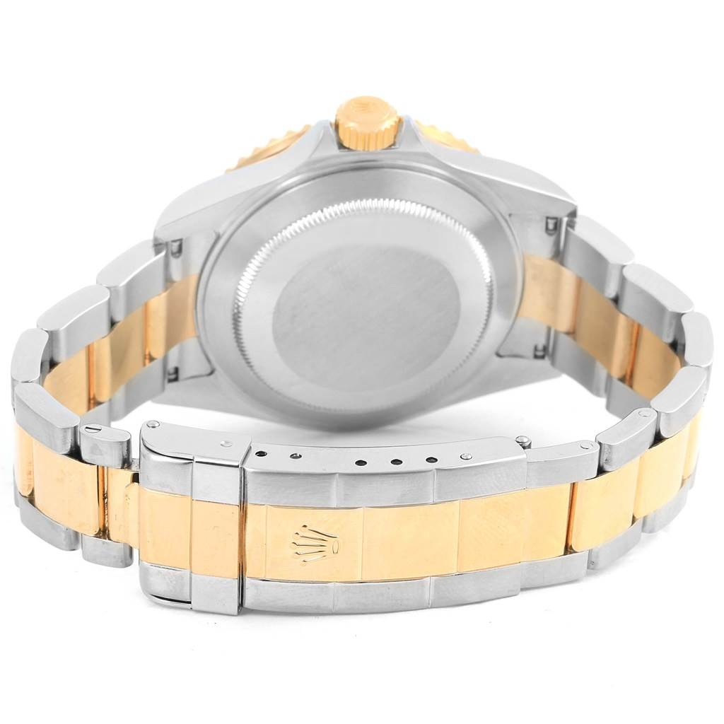 The image shows the back view and bracelet of a Rolex Submariner 16613 Men's Steel and Gold (two tone) Black Dial 16613 Men's Steel and Gold (two tone) Black Dial watch with a two-tone metal finish.