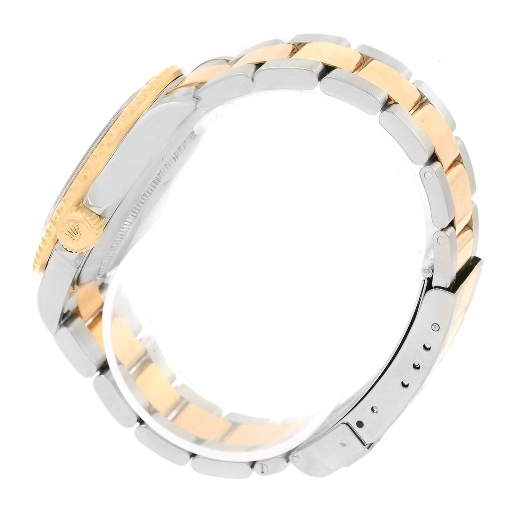 The image shows a side view of a Rolex Submariner 16613 Men's Steel and Gold (two tone) Champagne Dial 16613 Men's Steel and Gold (two tone) Champagne Dial watch, highlighting the bracelet and crown.