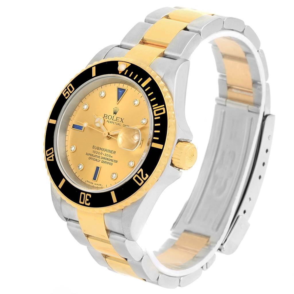 The image shows a Rolex Submariner 16613 Men's Steel and Gold (two tone) Champagne Dial 16613 Men's Steel and Gold (two tone) Champagne Dial watch from an angled side view, highlighting its gold and silver band and black bezel.