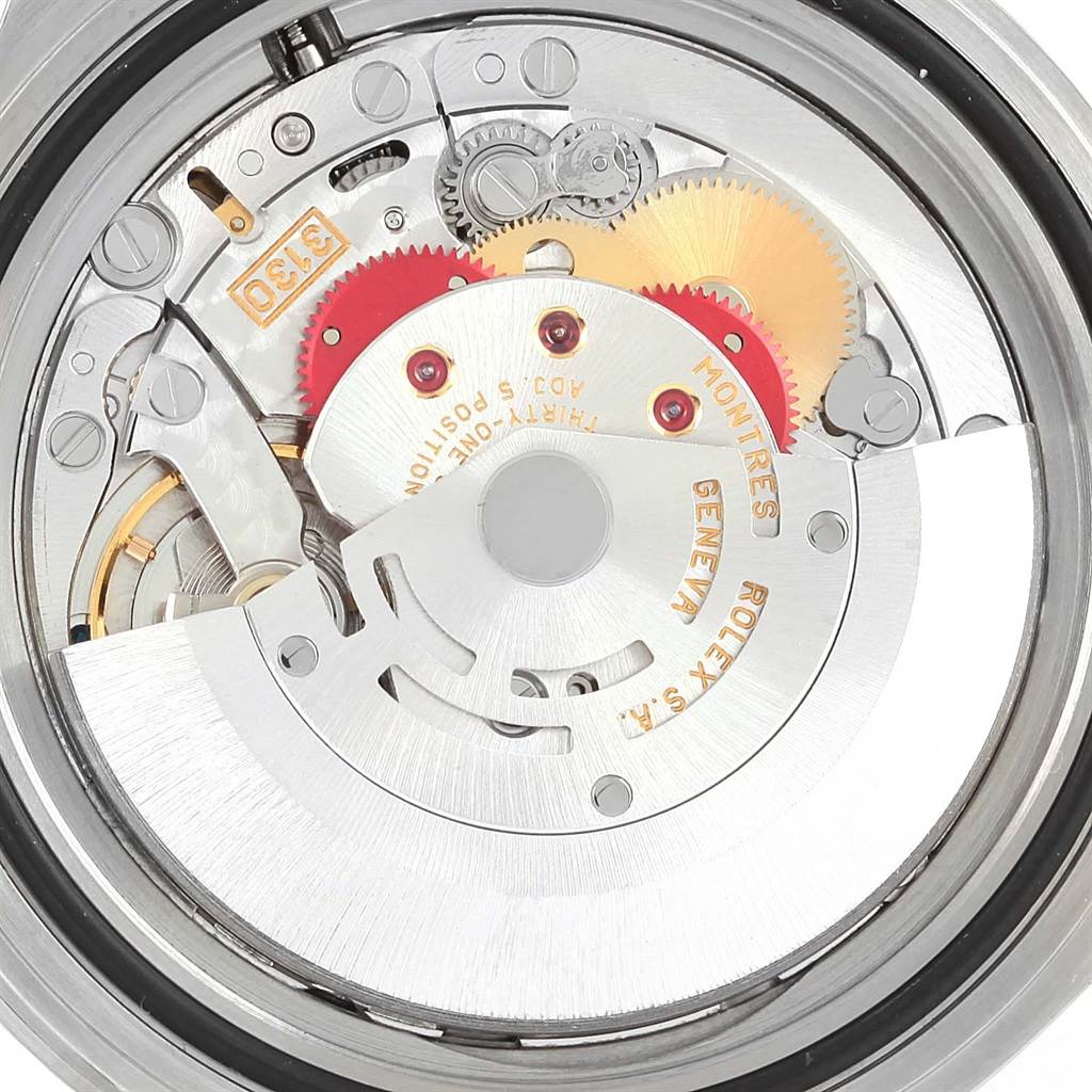 The image shows the internal movement of a Rolex Submariner 14060 Men's Stainless Steel Black Dial 14060 Men's Stainless Steel Black Dial watch, highlighting gears and the rotor from a top-down angle.