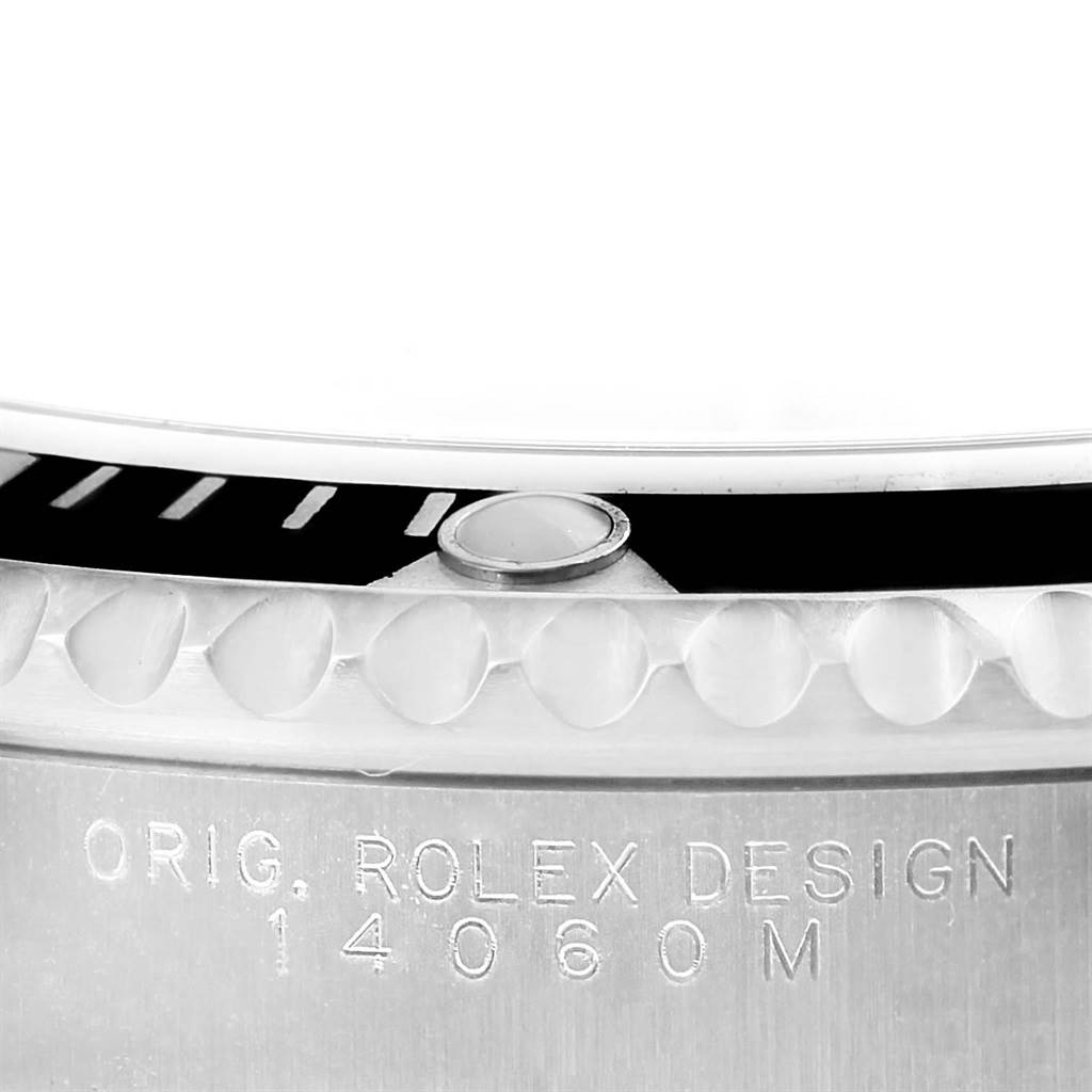 This image shows a close-up view of the bezel and case edge of a Rolex Submariner 14060 Men's Stainless Steel Black Dial 14060 Men's Stainless Steel Black Dial, highlighting its model number engraving.