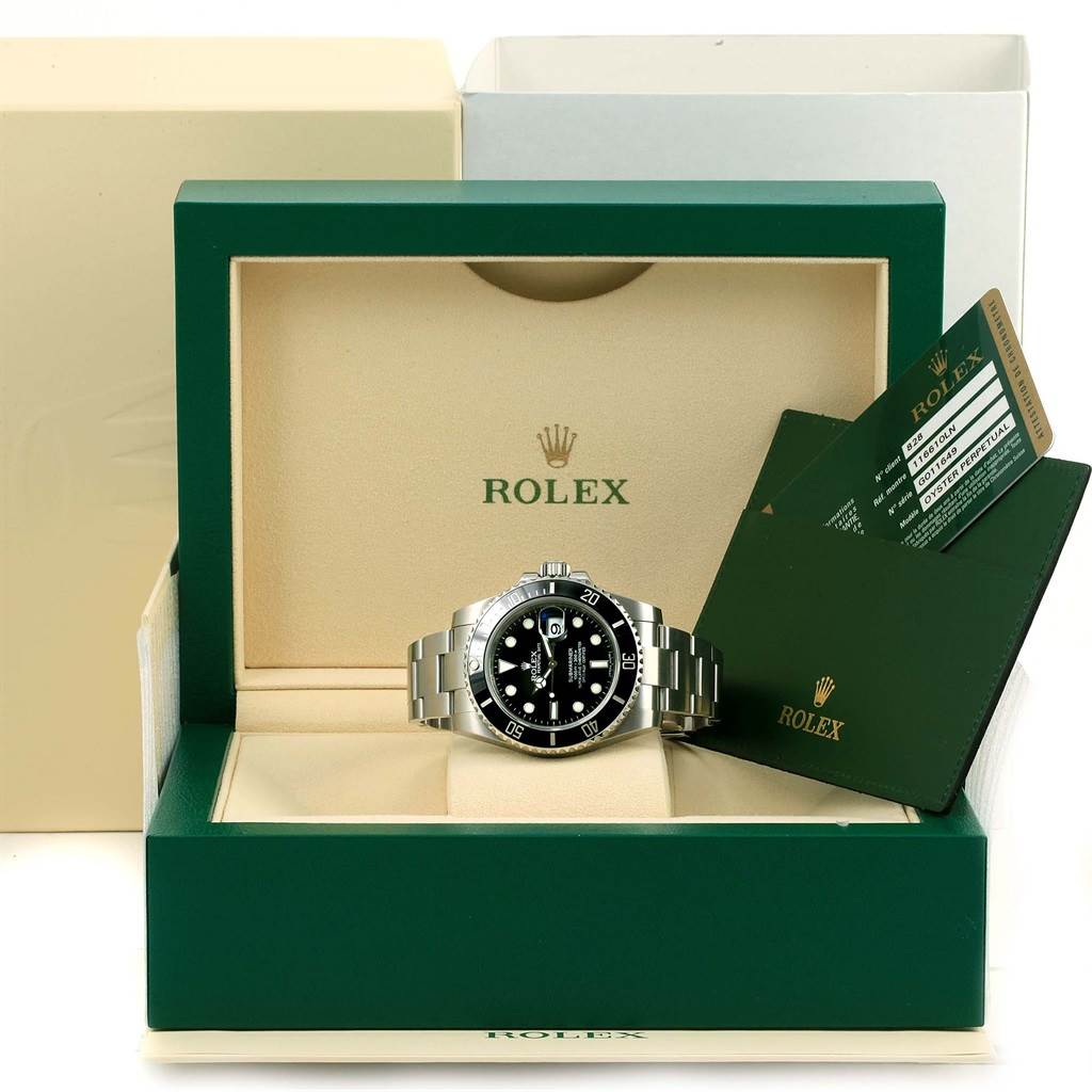 This image shows a front view of a Rolex Submariner 116610 Men's Stainless Steel Black Dial 116610 Men's Stainless Steel Black Dial watch inside its green box, along with warranty cards.