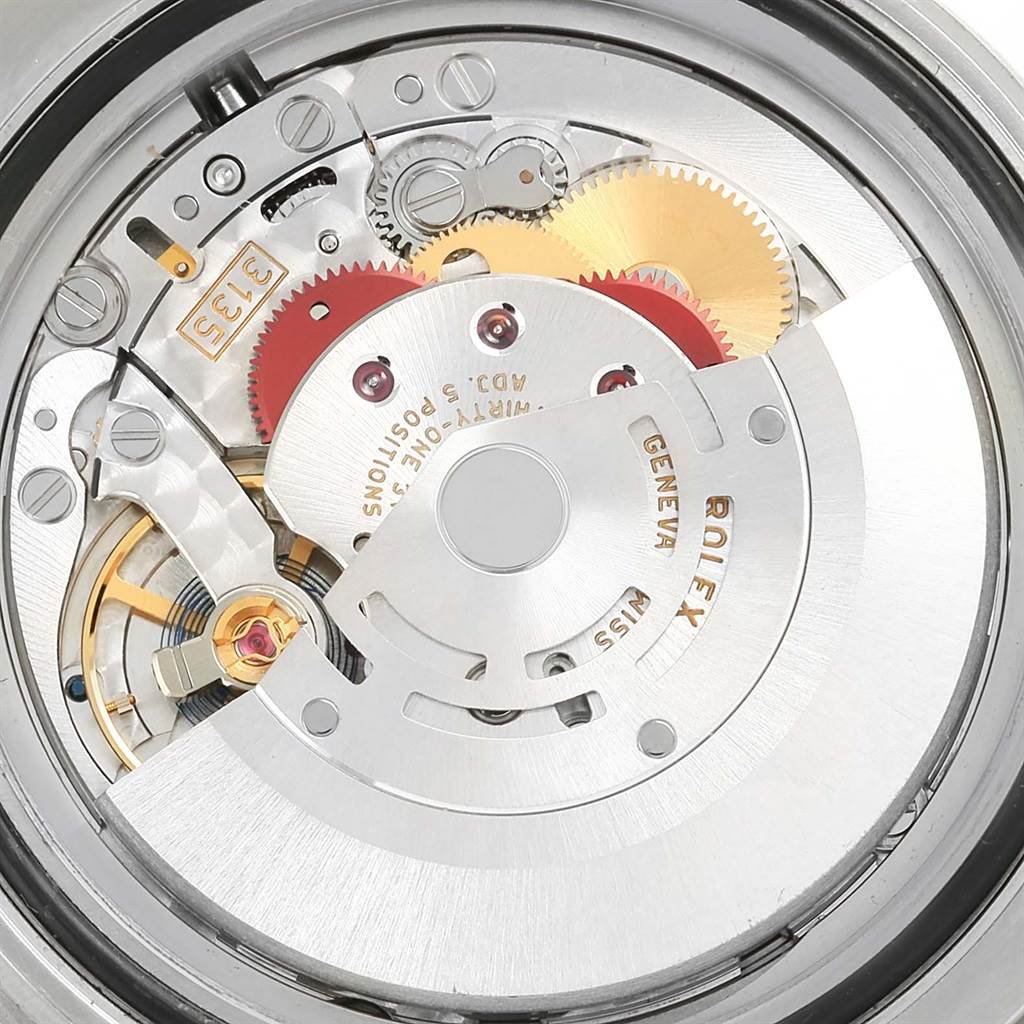 This image shows the intricate internal mechanics and movement of a Rolex Submariner 116610LV Men
s Stainless Steel Green Dial 116610LV Men
s Stainless Steel Green Dial watch.