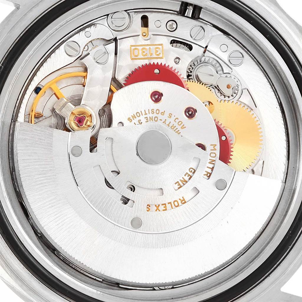 The image shows a close-up of the movement mechanism of a Rolex Submariner 14060 Men
s Stainless Steel Black Dial 14060 Men
s Stainless Steel Black Dial watch.