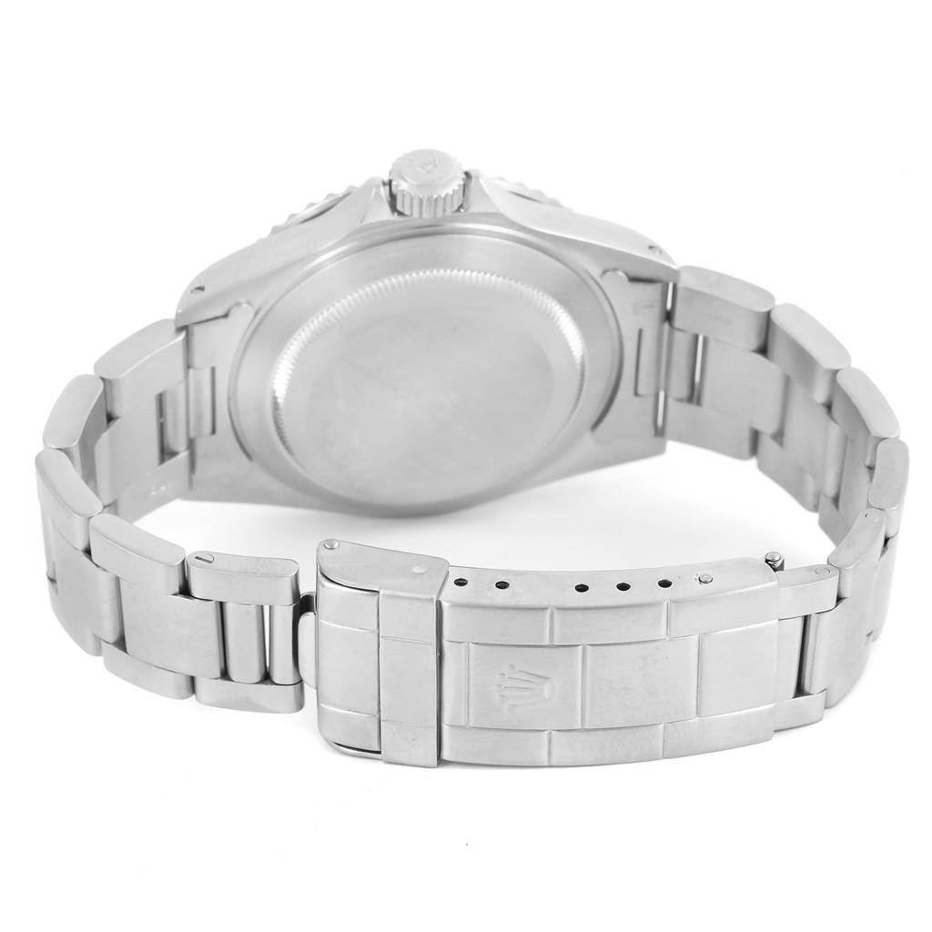 The image shows the back view of a Rolex Submariner 14060 Men
s Stainless Steel Black Dial 14060 Men
s Stainless Steel Black Dial watch, highlighting the case back and bracelet clasp.