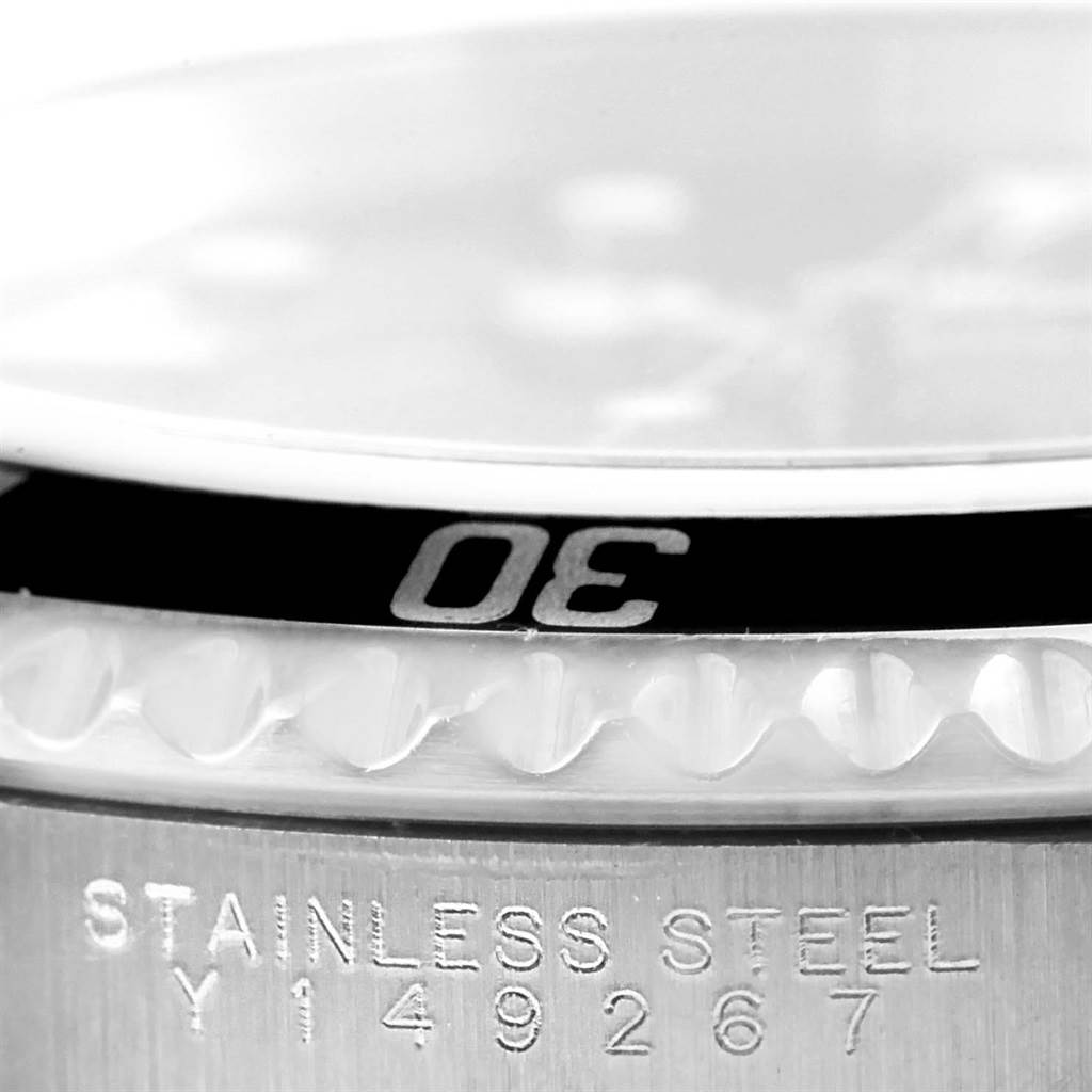 The image shows a close-up of the bezel and part of the case back of a Rolex Submariner 14060 Men
s Stainless Steel Black Dial 14060 Men
s Stainless Steel Black Dial watch, clearly displaying the "30" marking on the bezel.