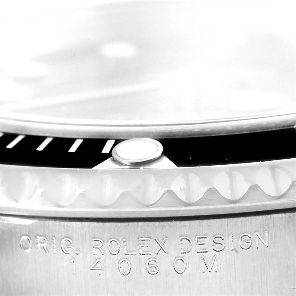 Close-up view of a Rolex Submariner 14060 Men
s Stainless Steel Black Dial 14060 Men
s Stainless Steel Black Dial, showing the bezel, case edge, and model engraving "14060M".