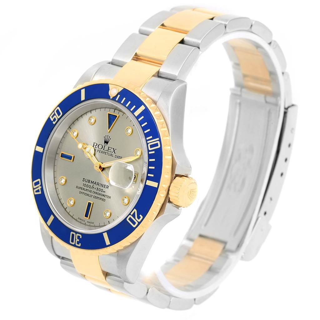 The image shows a Rolex Submariner 16613 Men's Steel and Gold (two tone) Grey Dial 16613 Men's Steel and Gold (two tone) Grey Dial watch at a side angle, highlighting the dial, bezel, crown, and part of the bracelet.