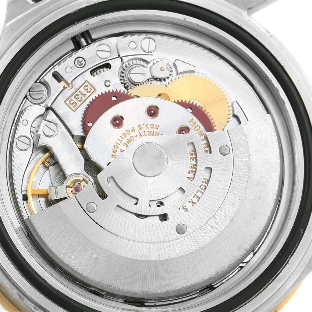 The image shows the internal mechanical movement of a Rolex Submariner 16613 Men's Steel and Gold (two tone) Grey Dial 16613 Men's Steel and Gold (two tone) Grey Dial watch from a rear case view.