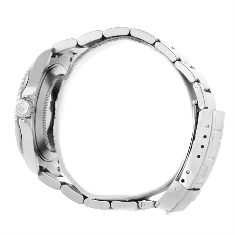 The image shows a side view of a Rolex Submariner 16610LV Men
s Stainless Steel Black Dial 16610LV Men
s Stainless Steel Black Dial watch, clearly displaying its crown and metal bracelet.